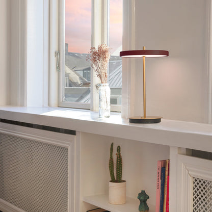 Asteria Move LED Portable Table Lamp in living room.