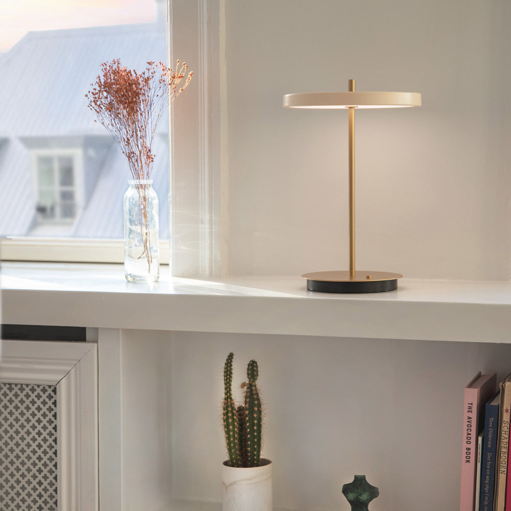 Asteria Move LED Portable Table Lamp in living room.