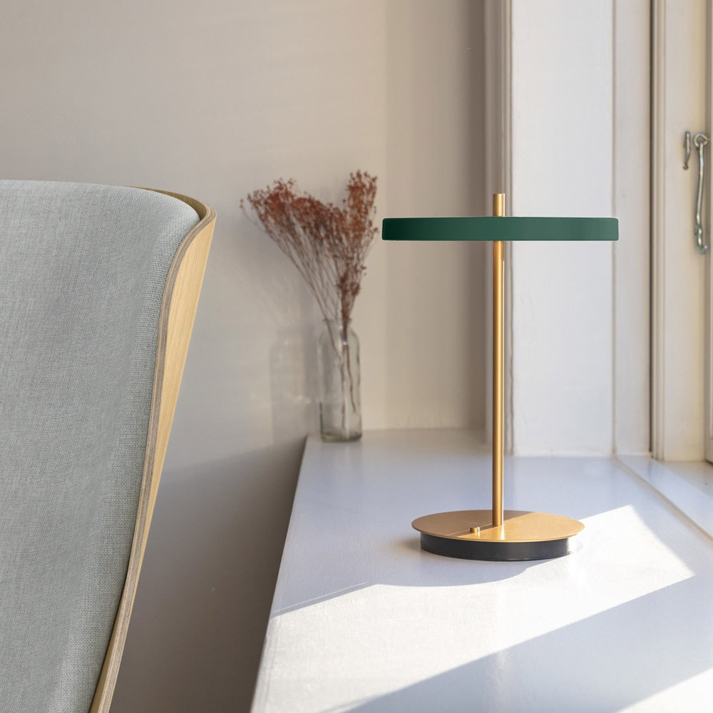 Asteria Move LED Portable Table Lamp in living room.