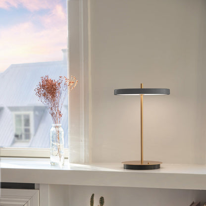 Asteria Move LED Portable Table Lamp in living room.