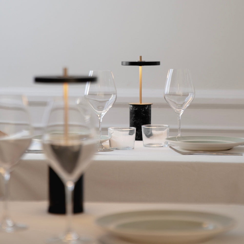 Asteria Move Mini LED Portable Table Lamp in dining room.