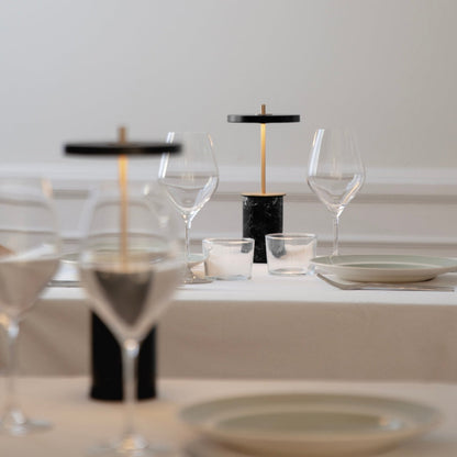 Asteria Move Mini LED Portable Table Lamp in dining room.