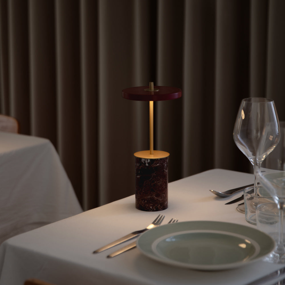 Asteria Move Mini LED Portable Table Lamp in dining room.