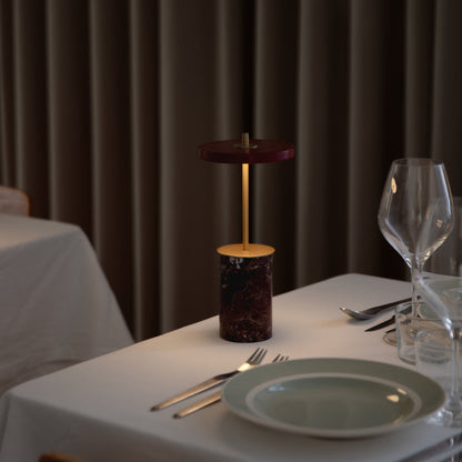Asteria Move Mini LED Portable Table Lamp in dining room.