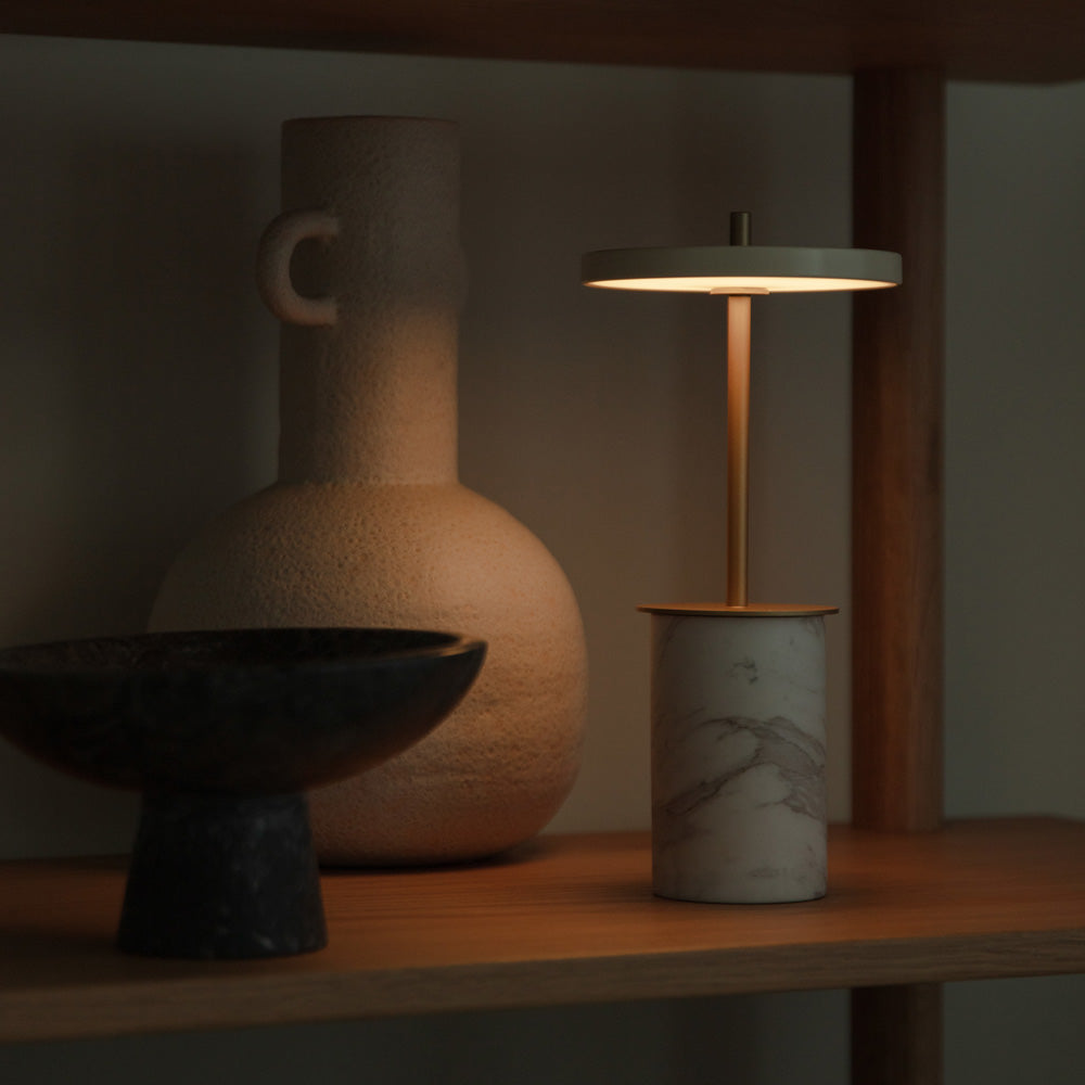 Asteria Move Mini LED Portable Table Lamp in living room.