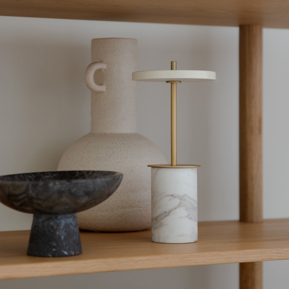 Asteria Move Mini LED Portable Table Lamp in living room.