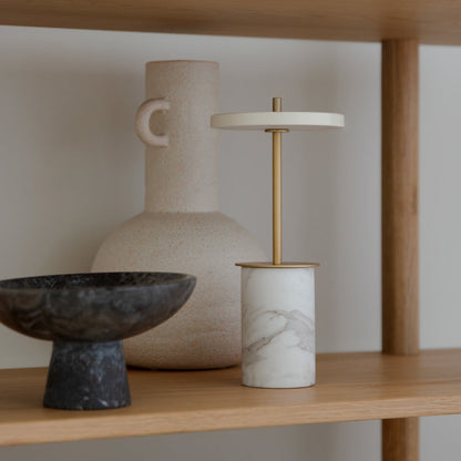 Asteria Move Mini LED Portable Table Lamp in living room.