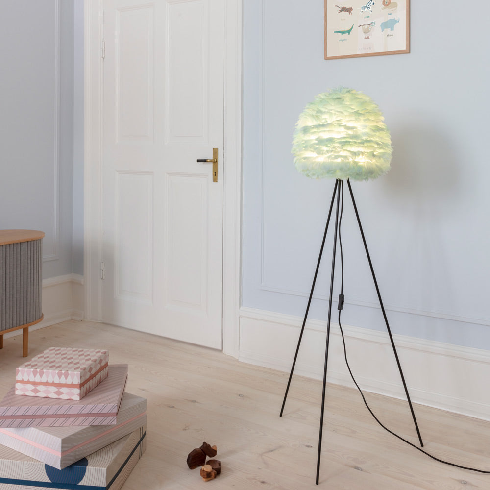 Eos Evia Tripod Floor Lamp in living room.