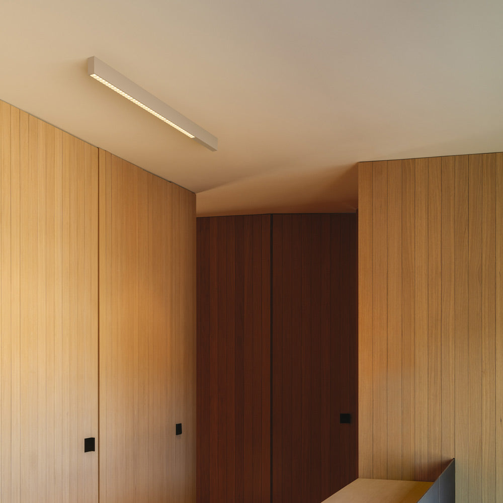 Offset LED Linear High Efficiency Flush Mount Ceiling Light in living room.
