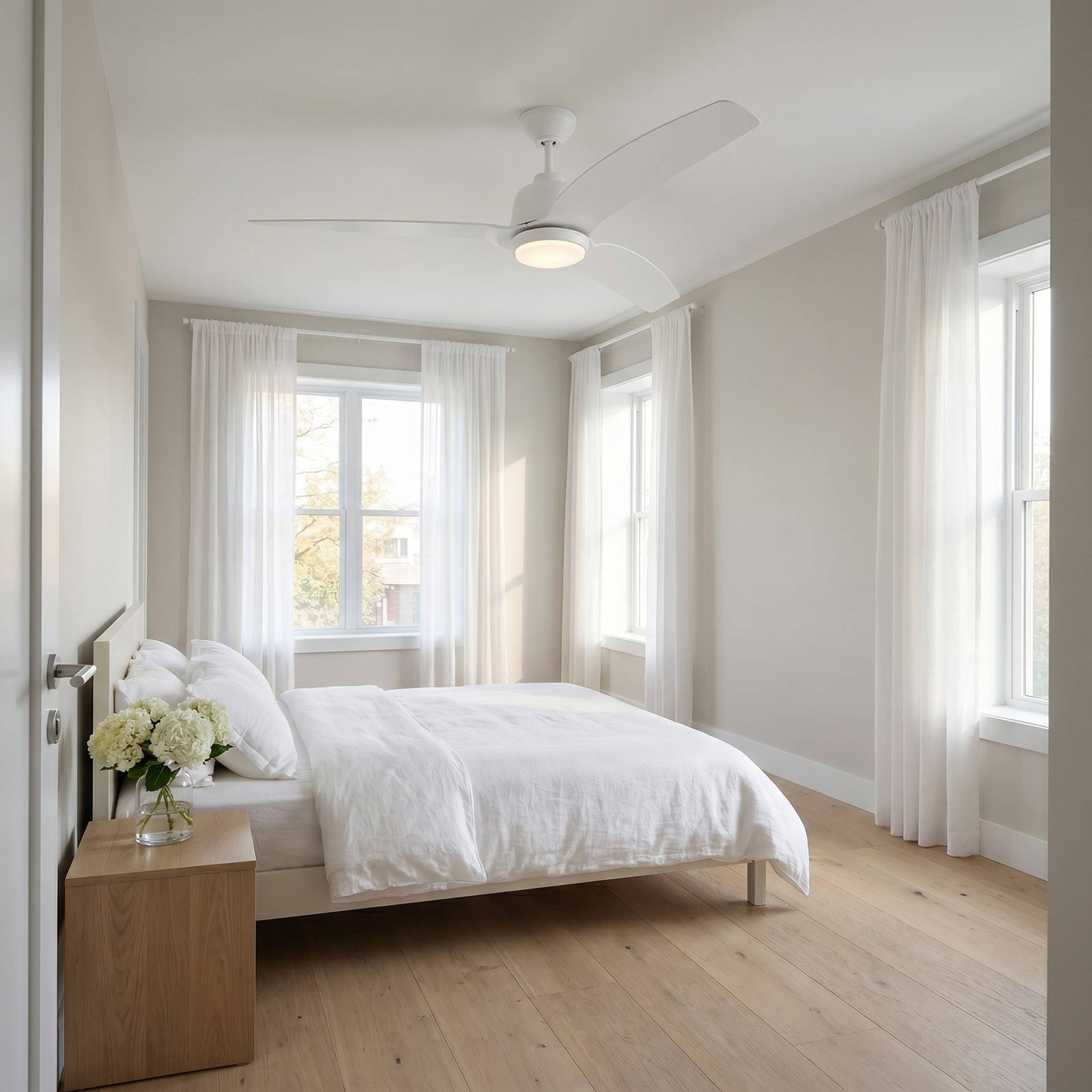 Avila Coastal Outdoor LED Ceiling Fan in bedroom.