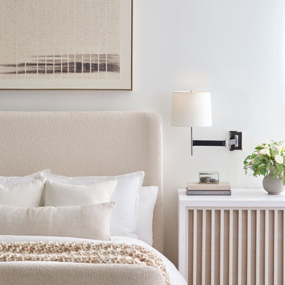 Elle LED Swing Arm Wall Light in bedroom.