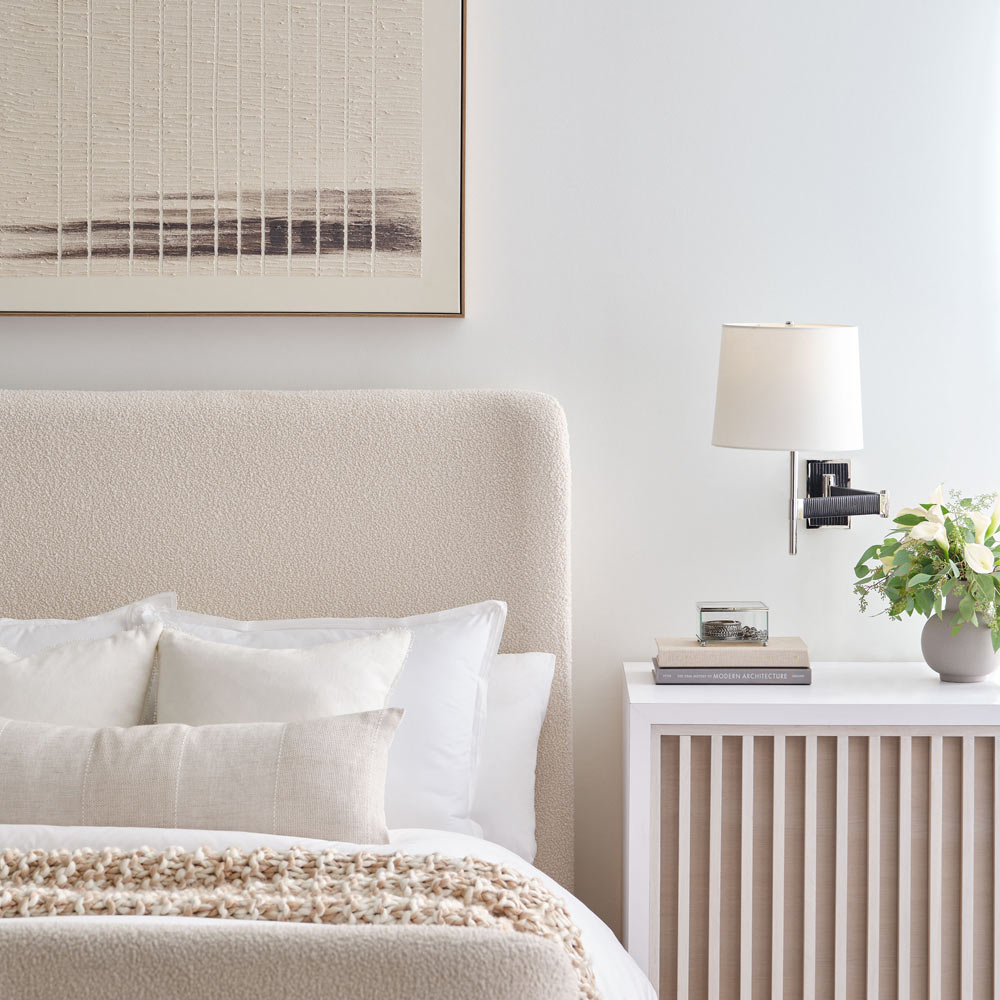 Elle LED Swing Arm Wall Light in bedroom.