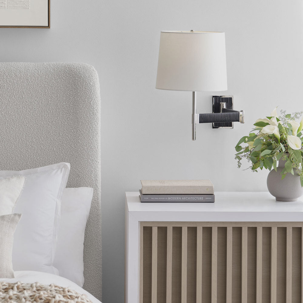 Elle LED Swing Arm Wall Light in bedroom.