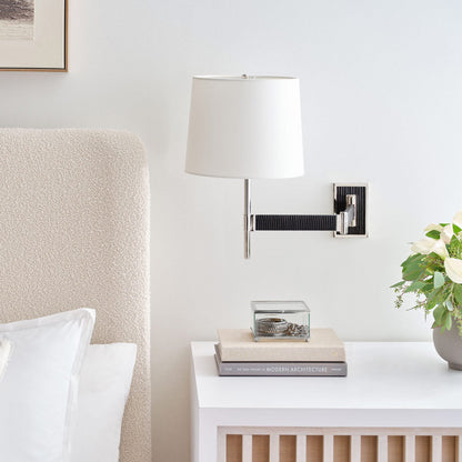 Elle LED Swing Arm Wall Light in bedroom.