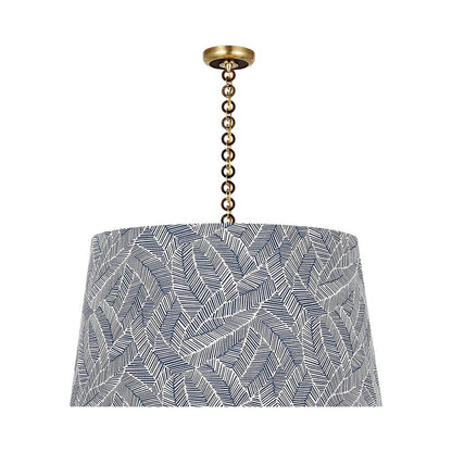 Evelyn Pendant Light in Hand-Rubbed Antique Brass and Natural Oak/Navy Abstract Leaf.