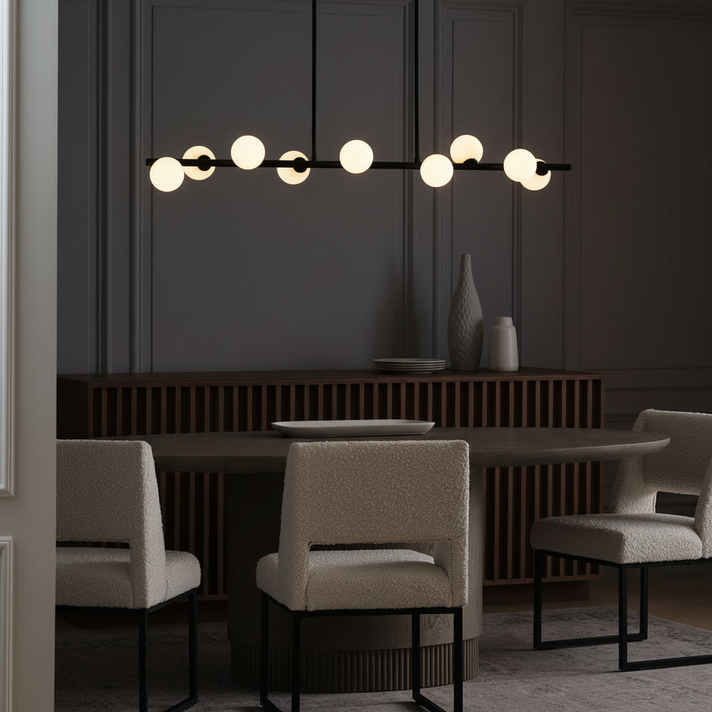 Modern dining room with a table, chairs, and decorative elements.