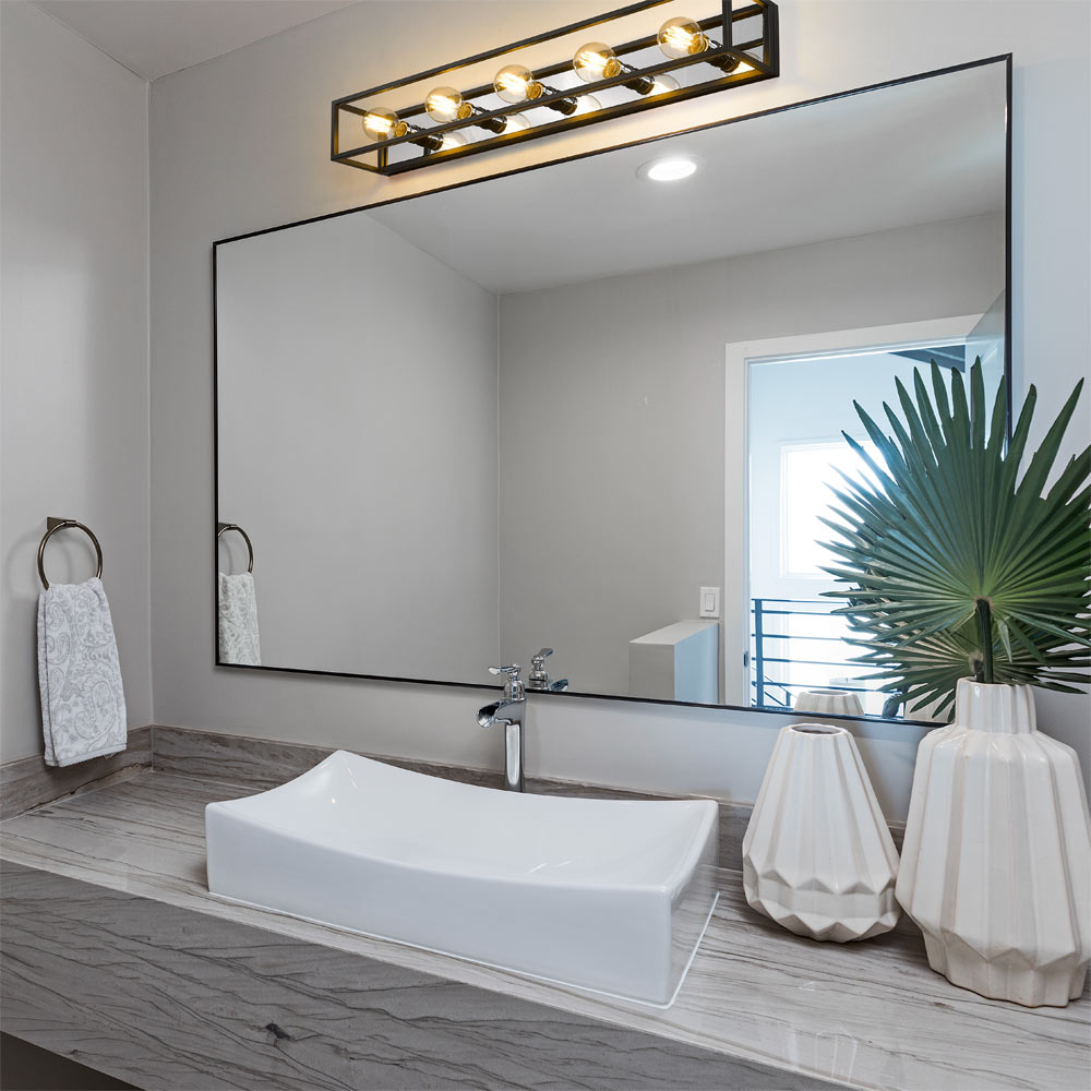 Kube Bath Vanity Light in bathroom.