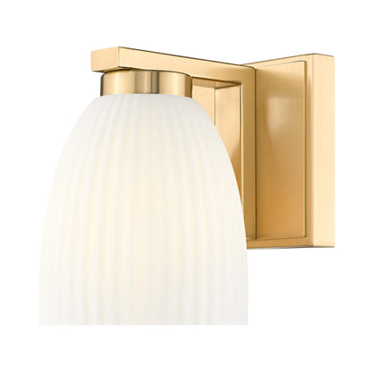 Naya Wall Light in Modern Gold.