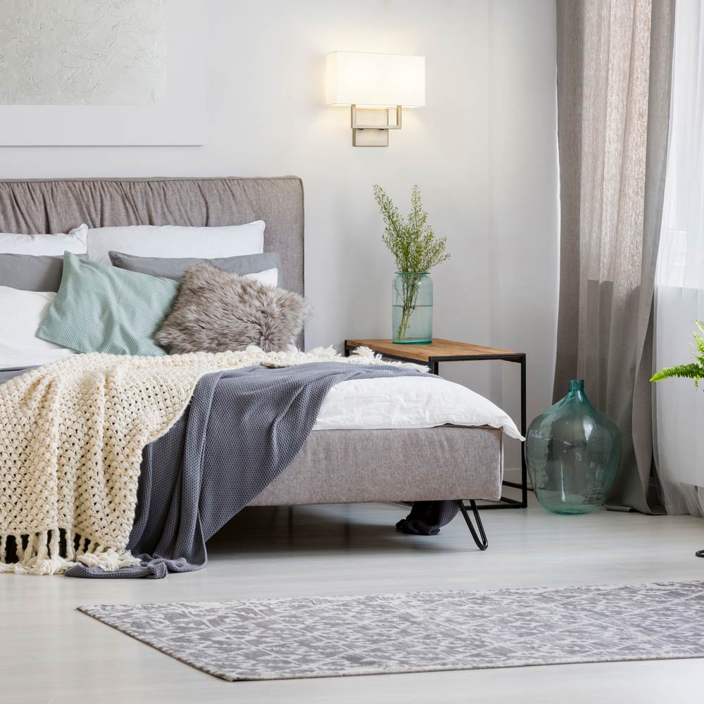 Saxon Double Arm Wall Light in bedroom.