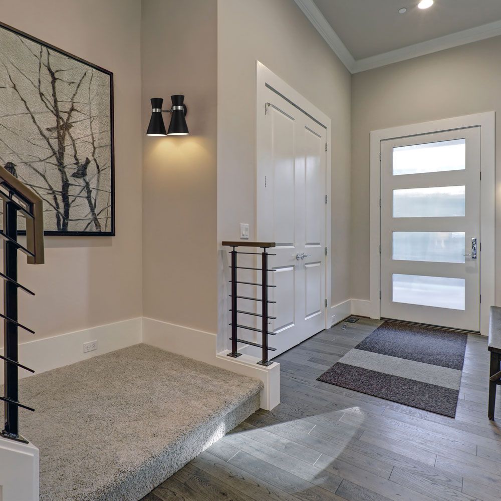 Soriano Wall Light in stairway.