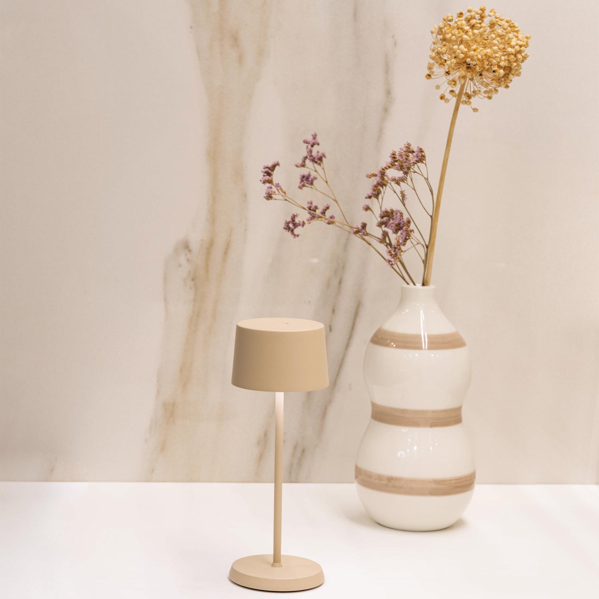Olivia Pro Micro Outdoor Rechargeable LED Table Lamp in living room.