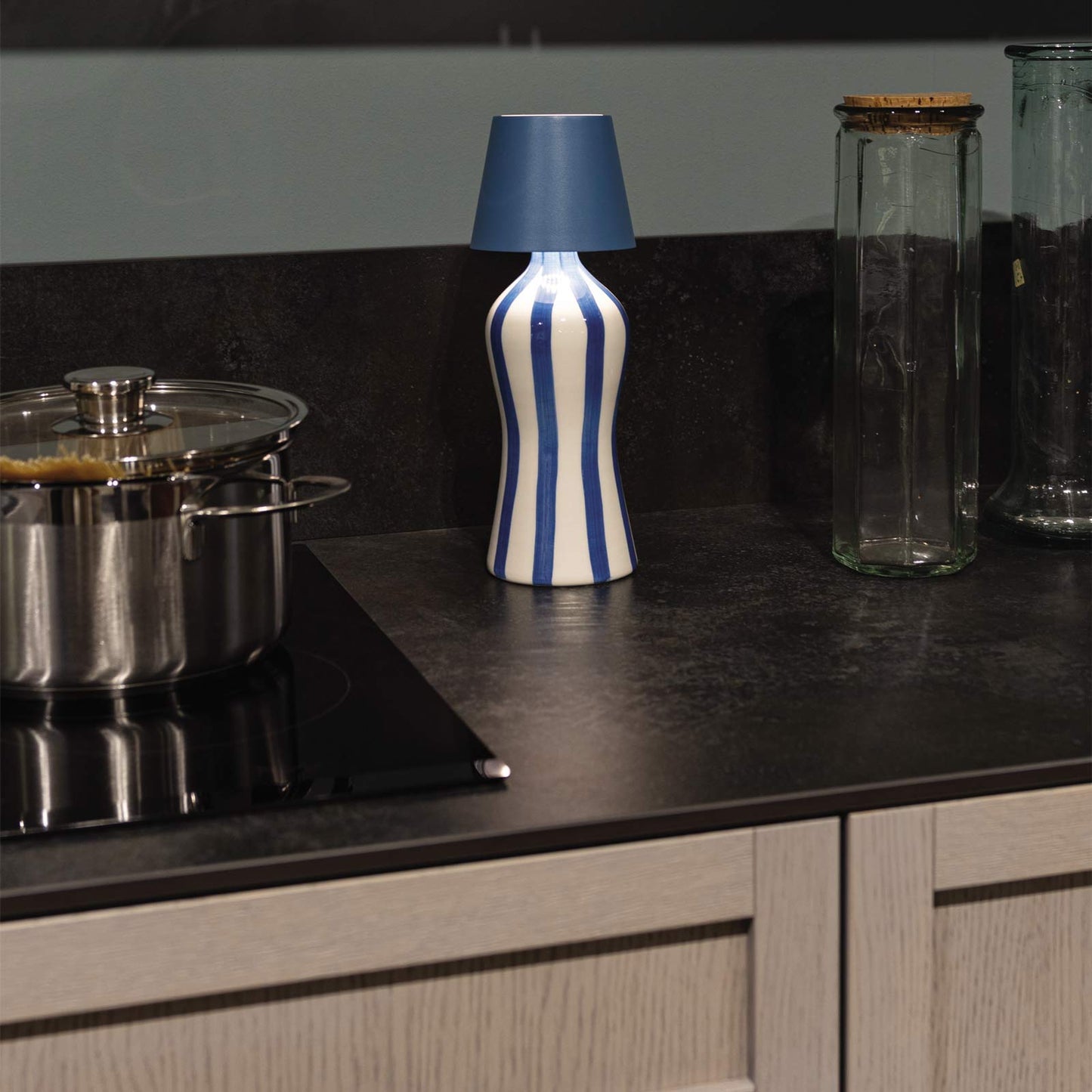 Poldina Pro Lido Bottle Outdoor Rechargeable LED Table Lamp in dining room.