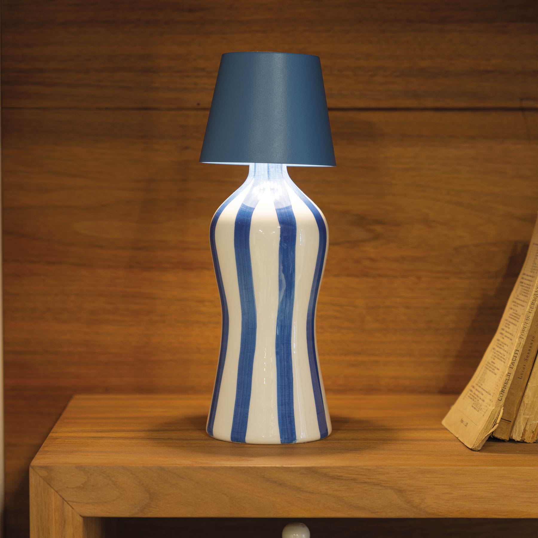 Poldina Pro Lido Bottle Outdoor Rechargeable LED Table Lamp in living room.
