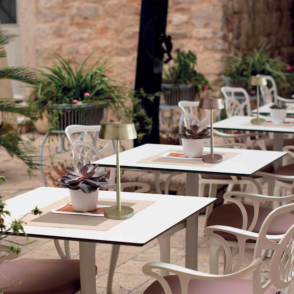 Sister LED Portable Table Lamp in Outside Area.