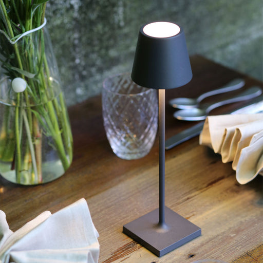 Poldina Pro LED Table Lamp in dining room.