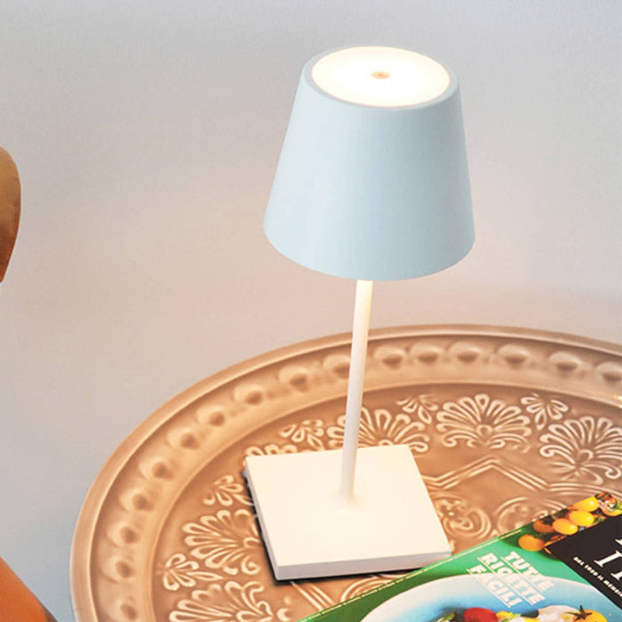 Poldina Pro Mini LED Table Lamp in living room.