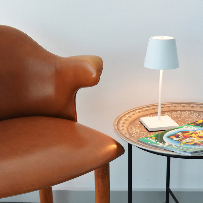 Poldina Pro Mini LED Table Lamp in living room.