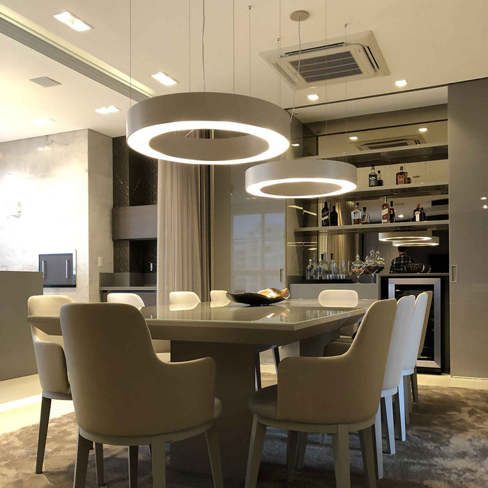 Cylindrical LED Pendant Light in dining room.
