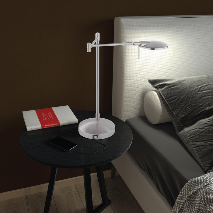 Dessau Turbo Swing LED Table Lamp in bedroom.