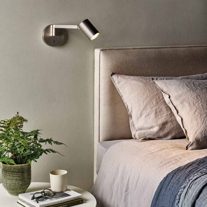 Ascoli Swing LED Wall Light in bedroom.
