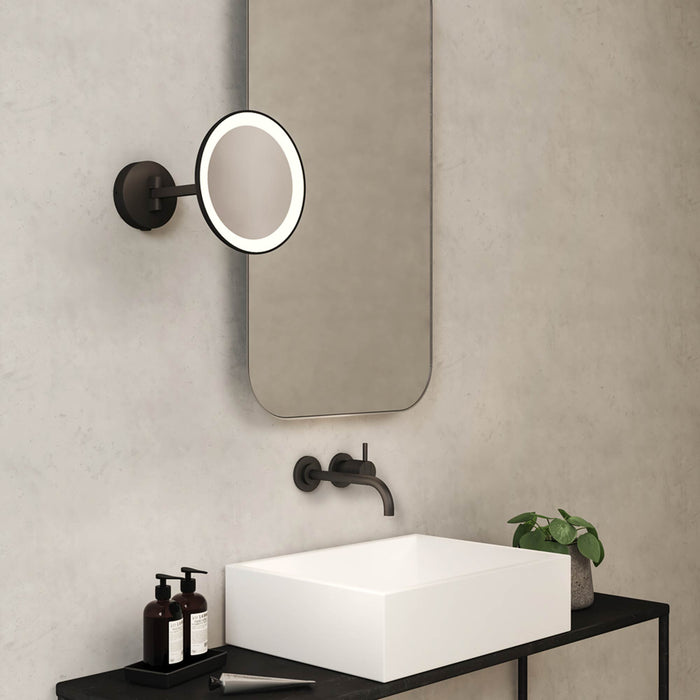 Mascali Round LED Magnifying Mirror in bathroom.