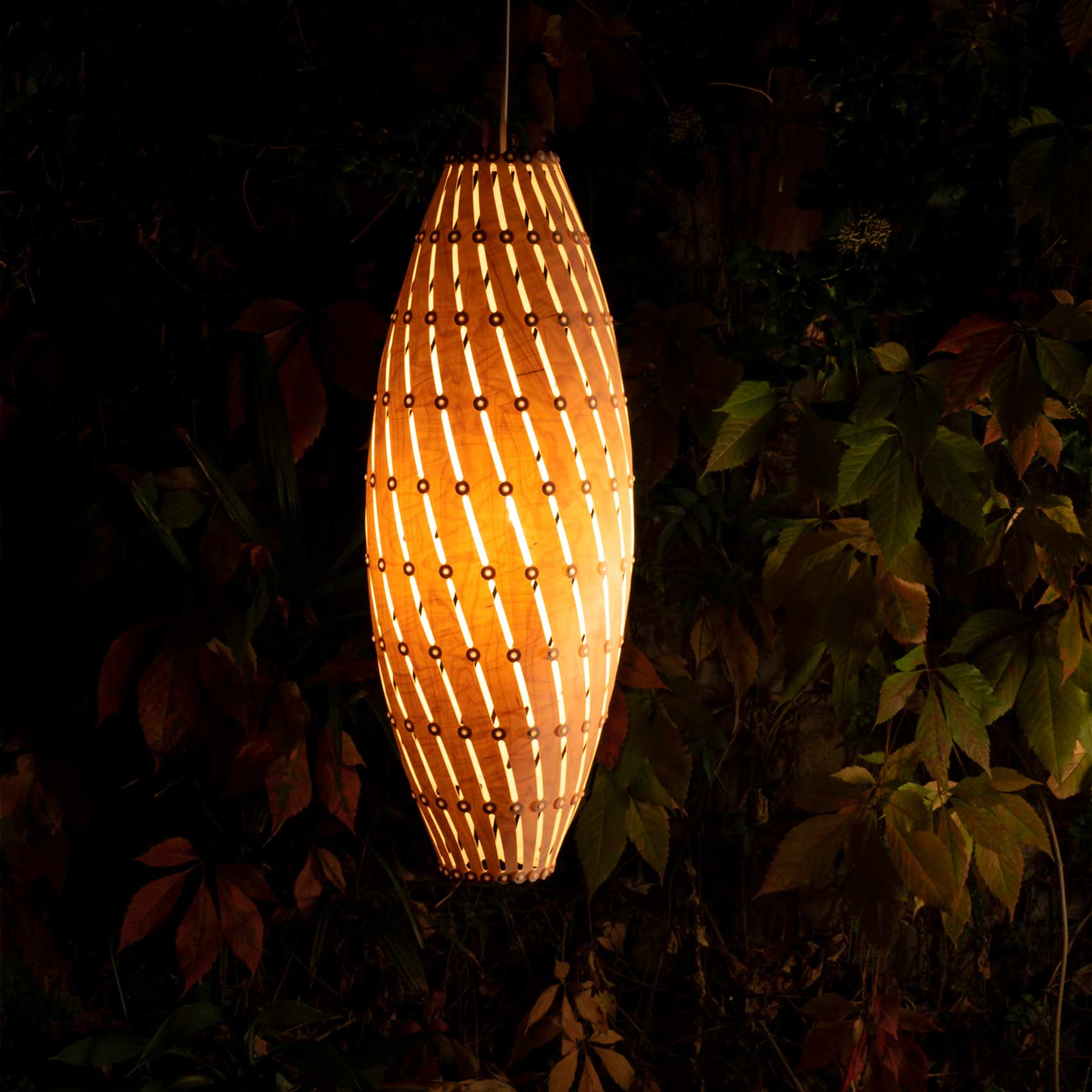 Ebb LED Roll Pendant Light in Outside Area.