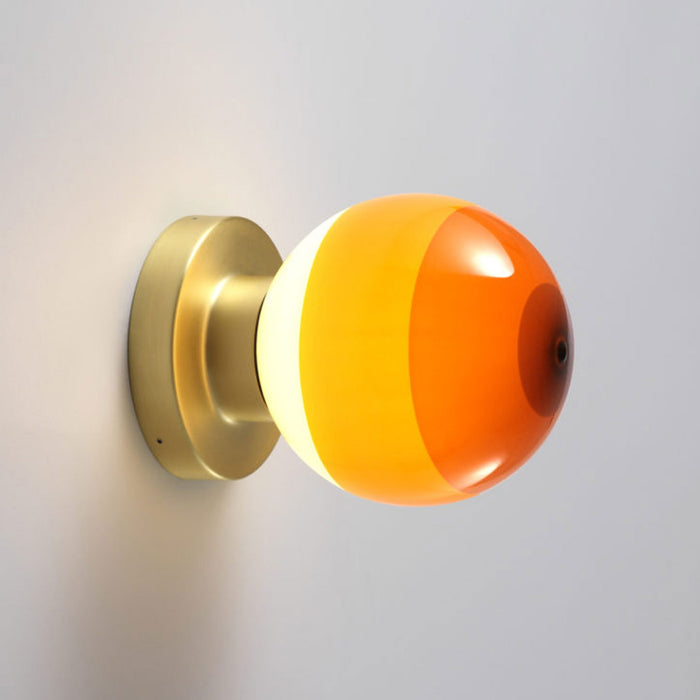 Dipping Light A2 LED Wall Light in Amber/Brushed Brass.