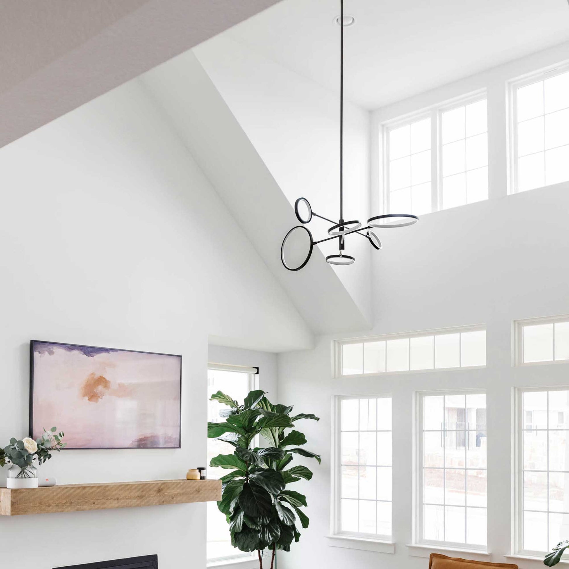 Saturn LED Chandelier in living room.