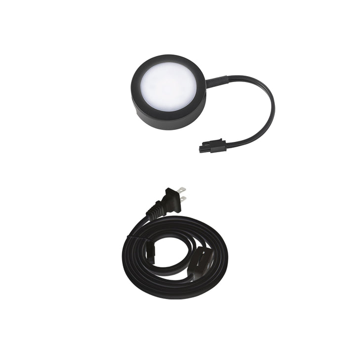 LED Puck Light with Single Lead Wire in Black.