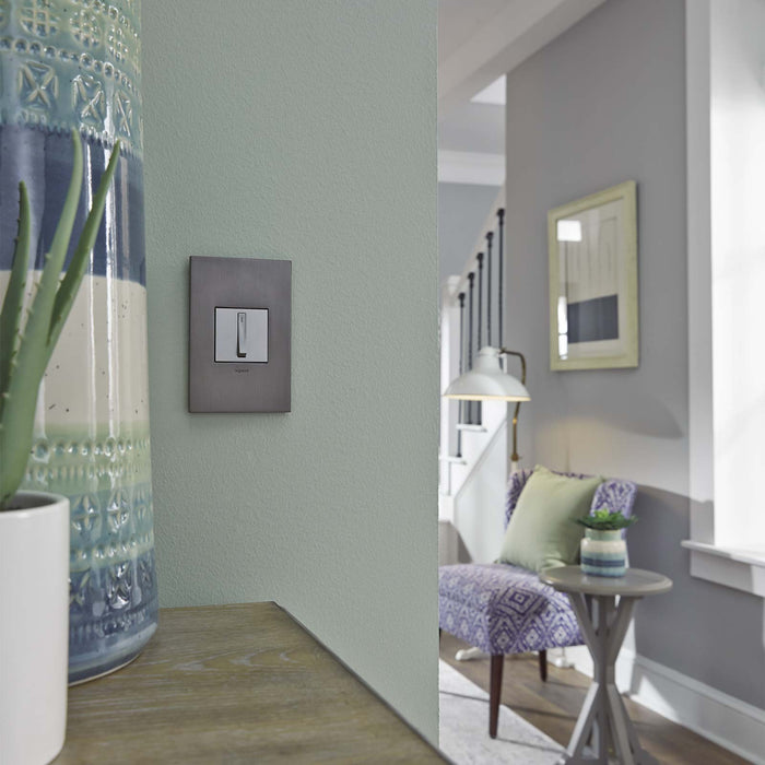 adorne® Cast Metals PLUS 1-Gang Wall Plate in living room.