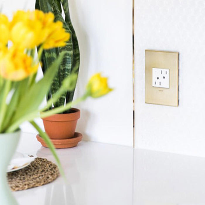 adorne® Energy-Saving On/Off Outlet in living room.