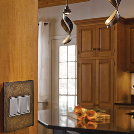 adorne® Hubbardton Forge Wall Plates in dining room.