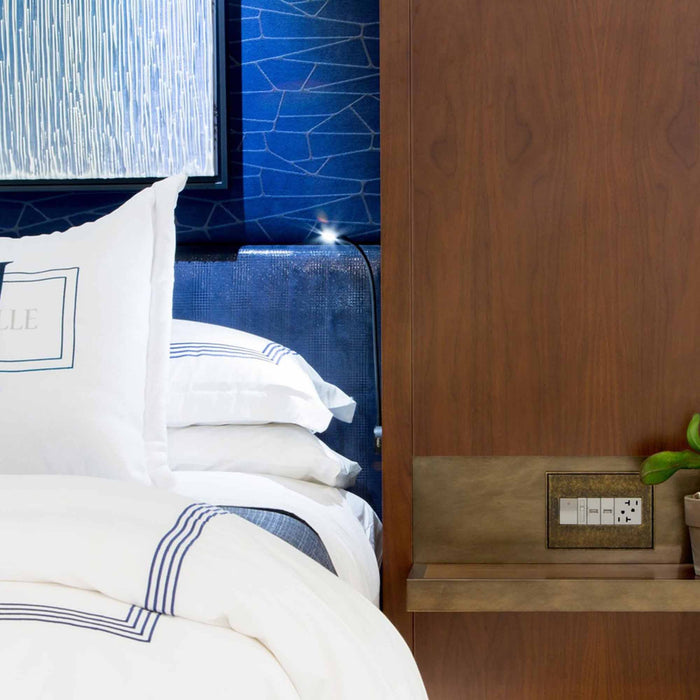 adorne® Hubbardton Forge Wall Plates in bedroom.