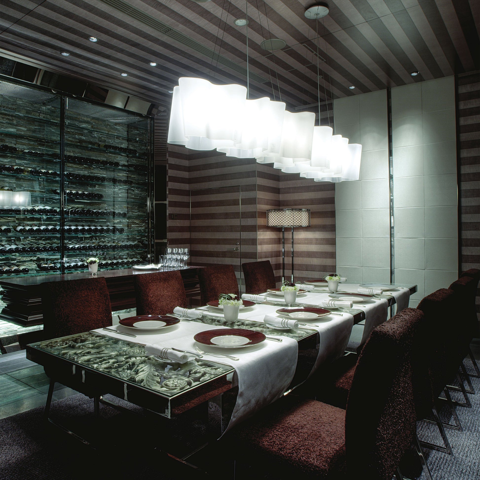 Logico Triple Linear Pendant Light in dining room.