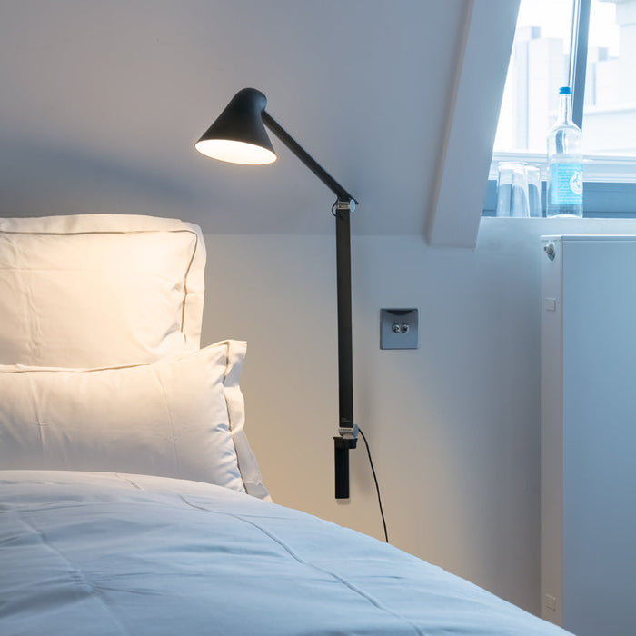 NJP Adjustable LED Wall Light in bedroom.