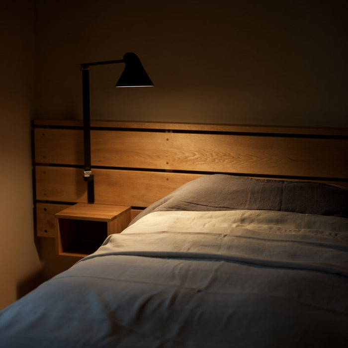 NJP Adjustable LED Wall Light in bedroom.