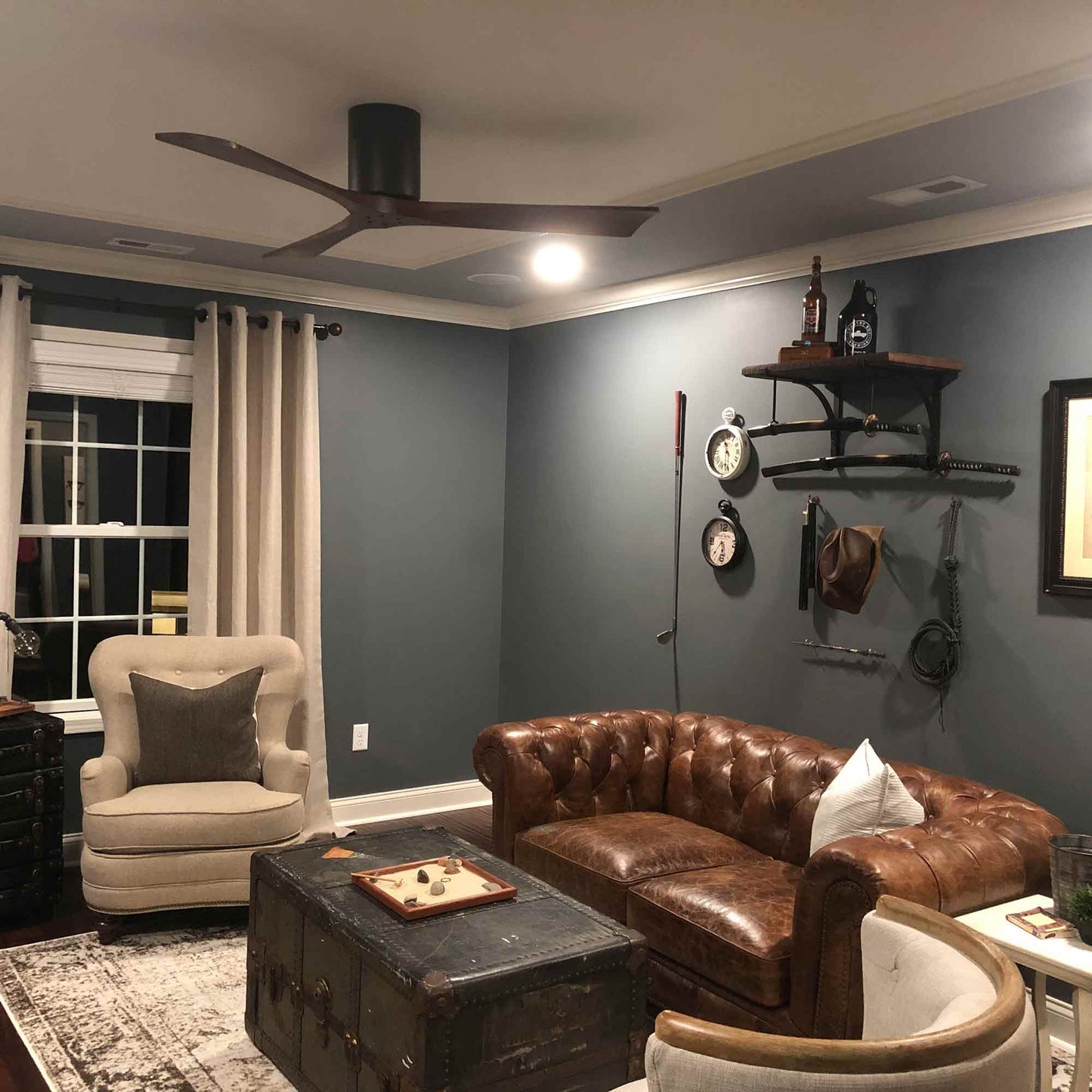 Irene IR3H Indoor / Outdoor Flush Mount Ceiling Fan in living room.