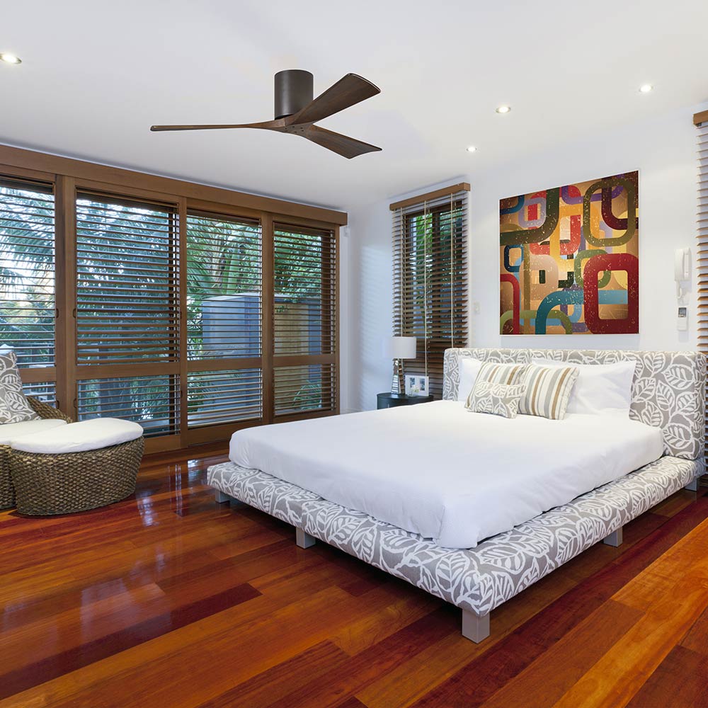 Irene IR3H Indoor / Outdoor Flush Mount Ceiling Fan in bedroom.