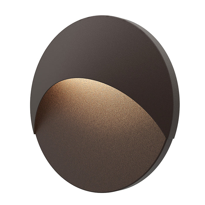 Ovos™ Round Outdoor LED Wall Light in Textured Bronze.