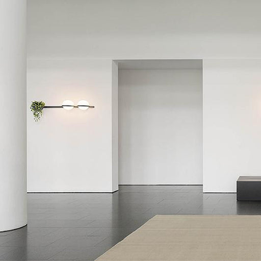 Palma Horizontal LED Wall Light with Planter in exhibition.